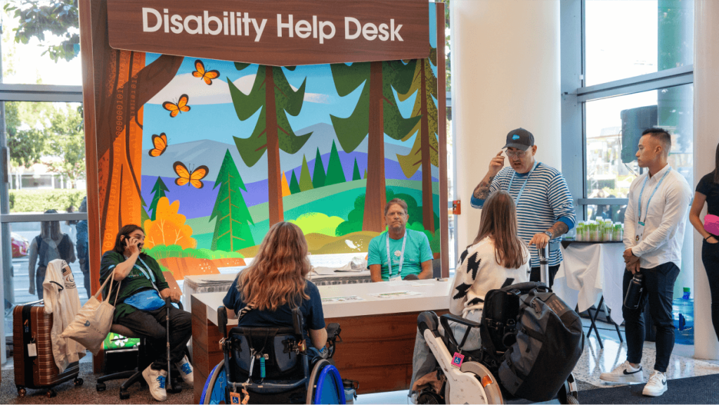 An image of people at the Dreamforce Disability Help Desk.